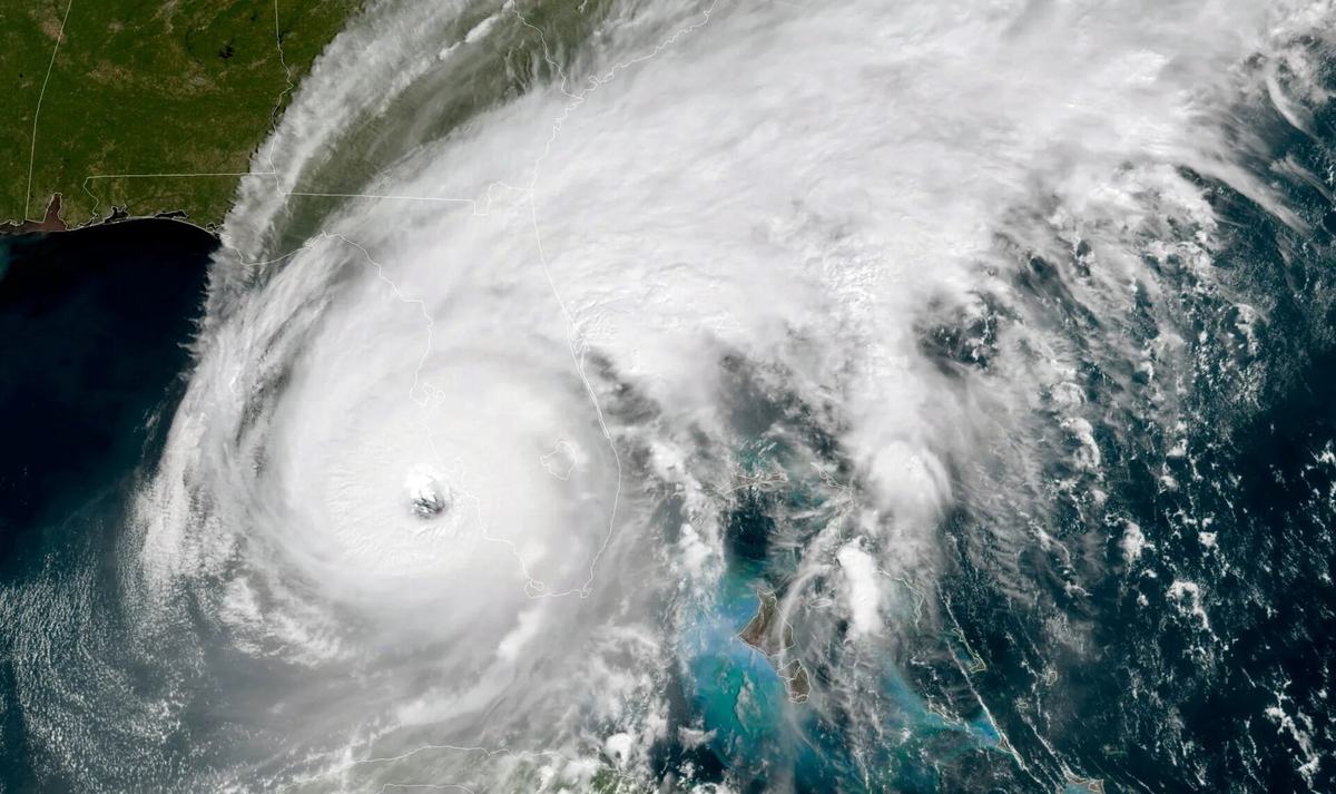 A satellite view of a hurricane with a clear eye approaching Florida