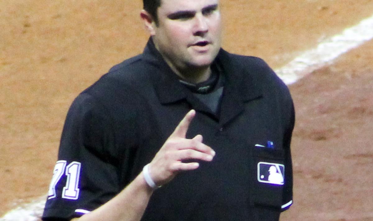A baseball official on the field during a professional game