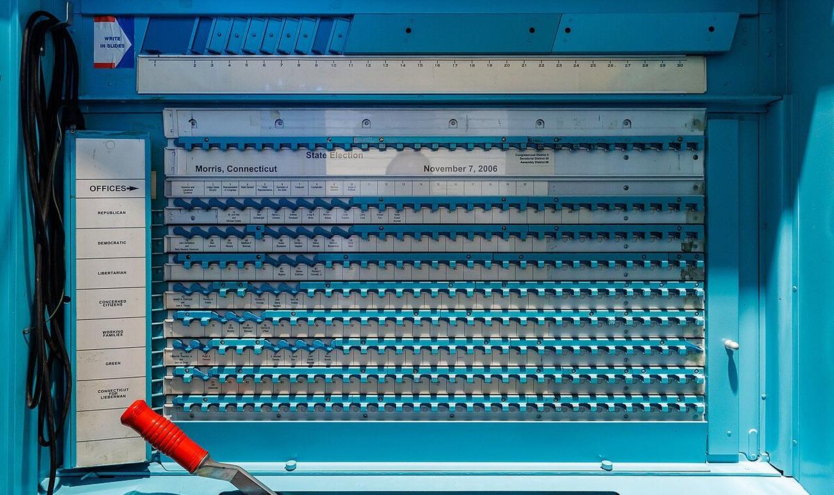 A mechanical lever voting machine in a US polling place